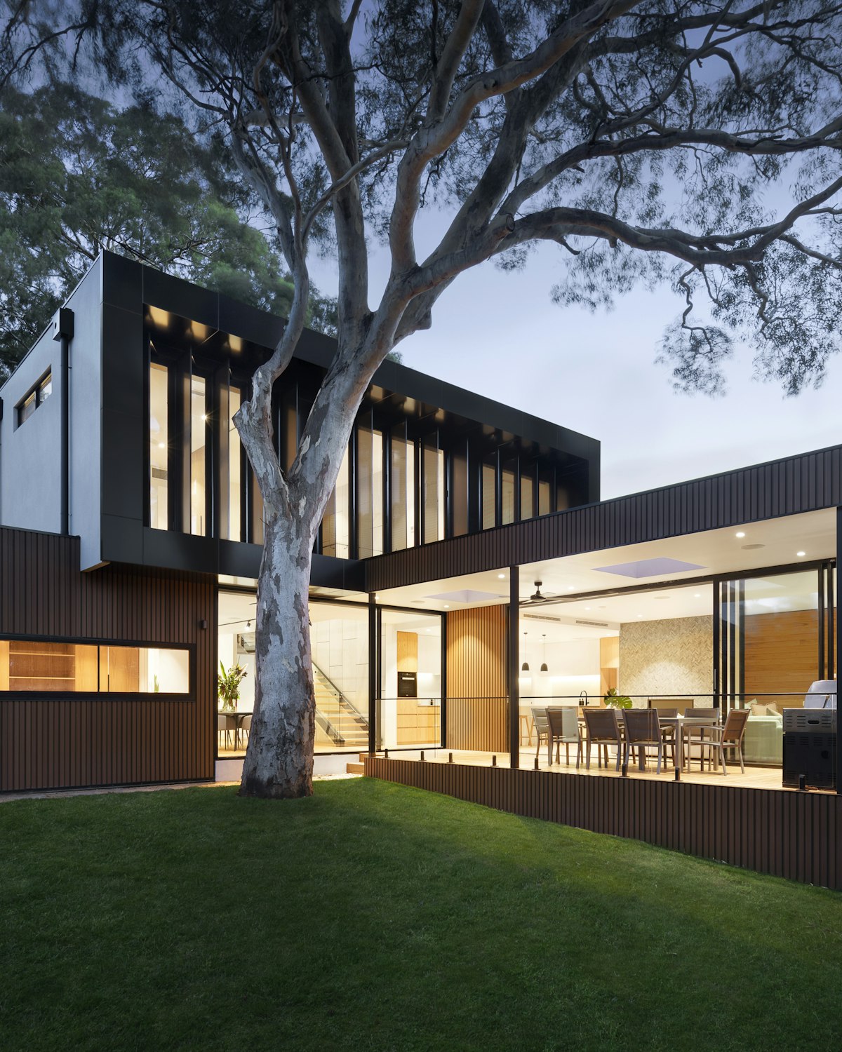 A modern custom home at dusk